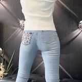 JEANS SKINNY CON TASCA SVAROSKY MACULATA