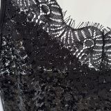 TOP TRASVERSALE PAILLETTES E PIZZO nero