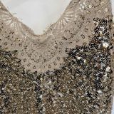 TOP TRASVERSALE PAILLETTES E PIZZO oro